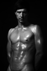 Obraz na płótnie Canvas Studio fashion shot of strong fitness handsome naked sports man