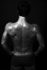Fototapeta premium Strong fitness back of young handsome man