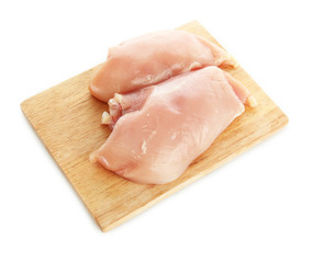raw chicken meat on cutting board, isolated on white