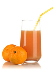 Delicious tangerine juice in glass and mandarins next to it