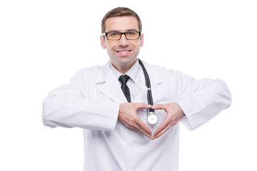Smiling doctor with heart gesture