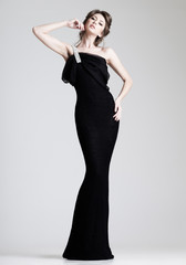 beautiful woman model posing in elegant dress in the studio - 48304695