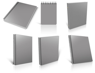 Six grey spiral blank notepad on white.