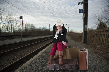 young woman waiting for her train