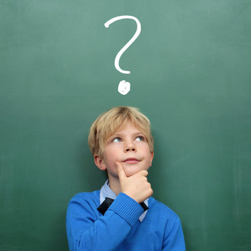 Child at the Blackboard with question Mark