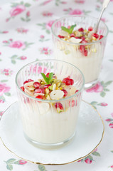 semolina dessert with pomegranate seeds and pistachios