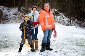 family ready to cut down a christmas tree