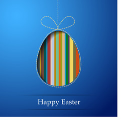 Fototapeta premium A striped egg on a blue background