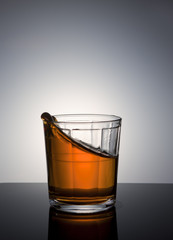 Movement of liquid in glass.