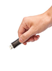 Closeup image: hand holding black USB data storage or connecting