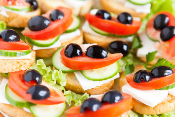 sandwiches with soft cheese and olives