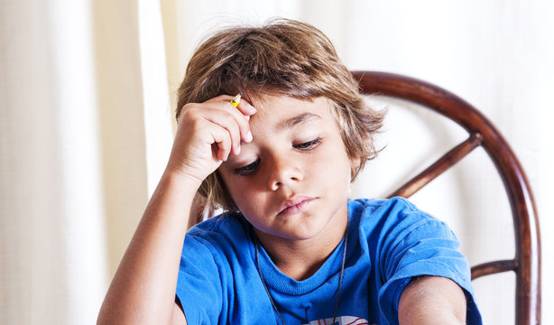 Child Concentrating On His Homework