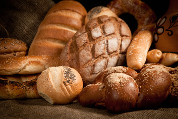 assortment of baked bread on sacking