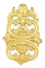 of an ancient gold ornament on a white background