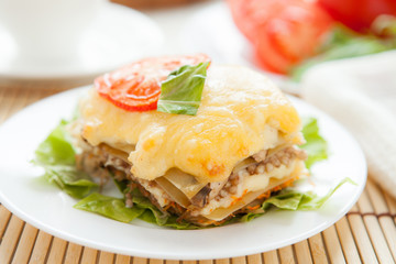 piece of vegetable lasagna on a white plate