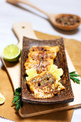 Fried white fish, served with lime and parsley