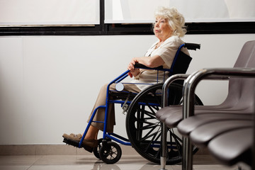 Pensive Elderly Woman On Wheelchair