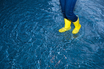 rubber boots walking in the water