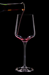 Red wine splashing in a glass.Close up