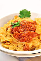 italian pasta - farfalle with meat and tomato sauce