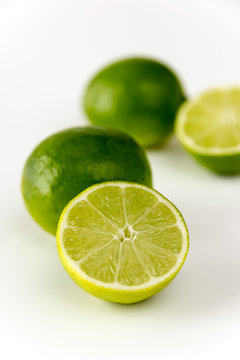 CLose-up of cut limes isolated on white