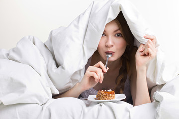 young  girl on diet eating spoon