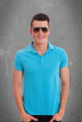 casual man wearing sunglasses and polo shirt