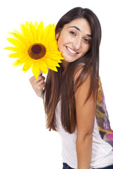 beautiful young woman smiling with a sunflower