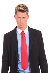 Serious executive in suit posing