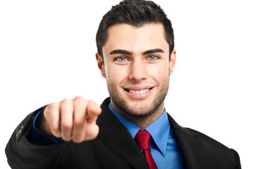 Handsome businessman pointing his finger at you