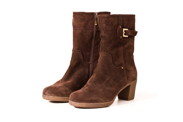 Beautiful suede boots isolated on white background