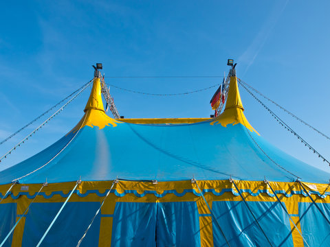 Roof part of a blue and yellow big top circus tent