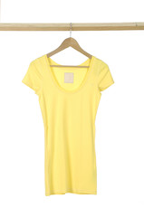 Yellow shirt hanging on wooden hangers