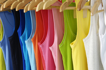 Row of many colorful shirt clothespins on rope