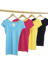 colorful shirt hanging on wooden hangers