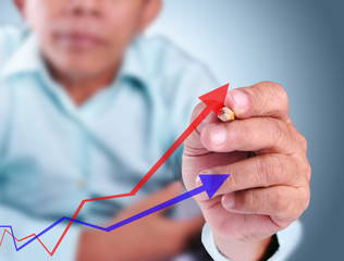 Business man touching growth graph of success