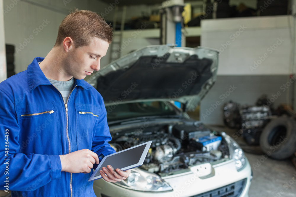 Poster auto mechanic working on tablet pc