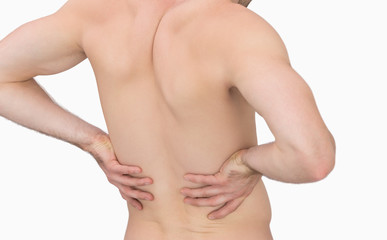 Naklejka premium Rear view of muscular man with backache