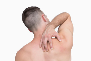 Obraz premium Rear view of shirtless man with neck pain