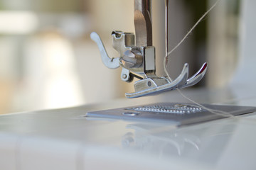 Needle of a sewing machine closeup