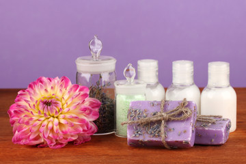 Obraz na płótnie Canvas ingredients for soap making on violet background