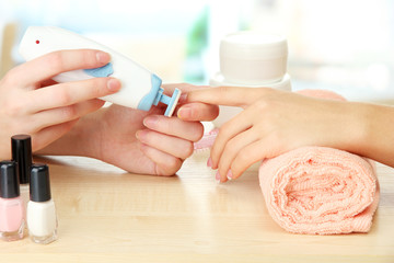 Manicure process in beauty salon, close up