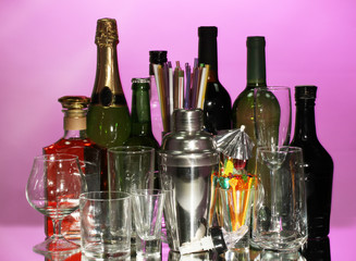 Collection of various glasses and drinks on color background