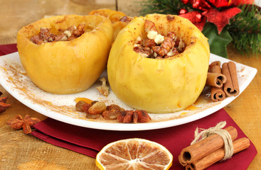 Baked apples on plate close up