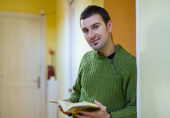 Young spanish man reading