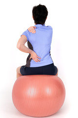 Woman with gym ball doing exercises