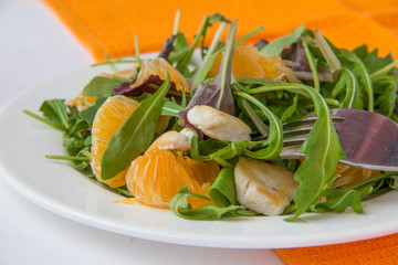 Salad with lettuce, chicken and tangerines