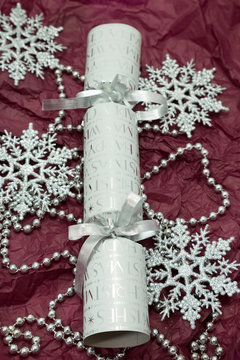 Silver Christmas Cracker With Snowflake Decorations.