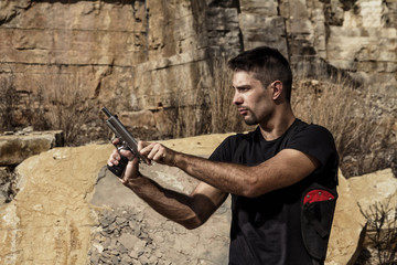 menacing man with a handgun