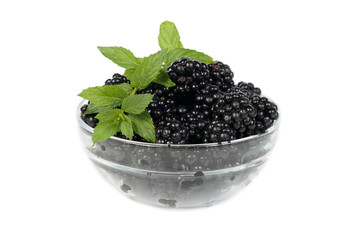 Blackberry with mint leaves in a bowl isolated on white